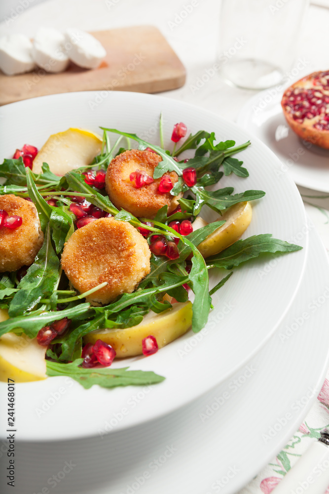 Goat cheese, garden rocket and pomegranate salad.