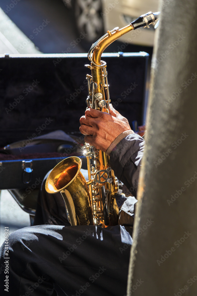 Fototapeta premium Trumpet player playing jazz song on New Orleans street corner