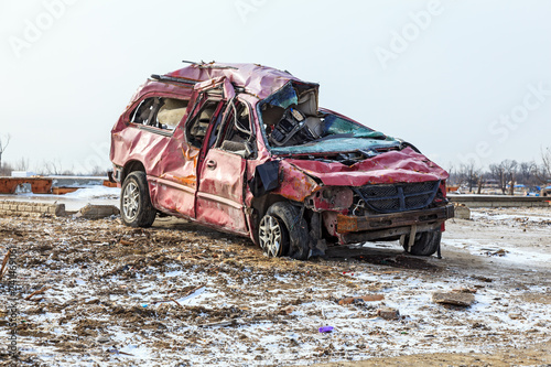 A red car that was destroyed by a tornado in Washington, Illinois in November