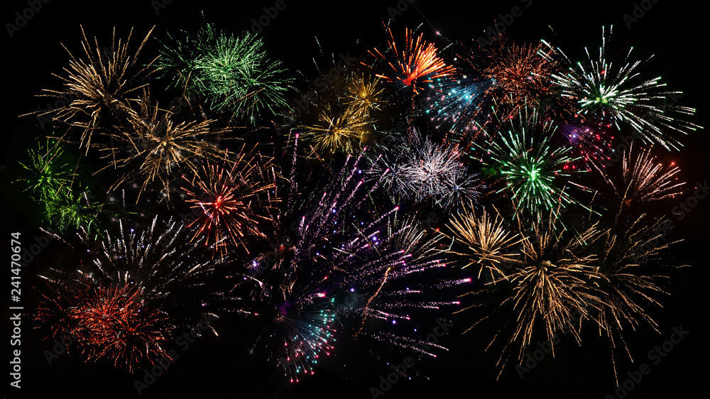 Fototapeta premium Colorful composite of fireworks in vivid colors good as background