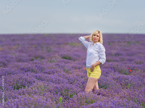 Fototapeta Naklejka Na Ścianę i Meble -  Young girl posing in a lavender field.