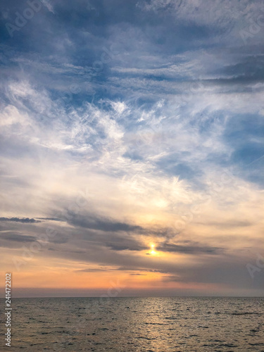 View of the sandy beach of the sea coast. Sunset sky, Durres, Albania