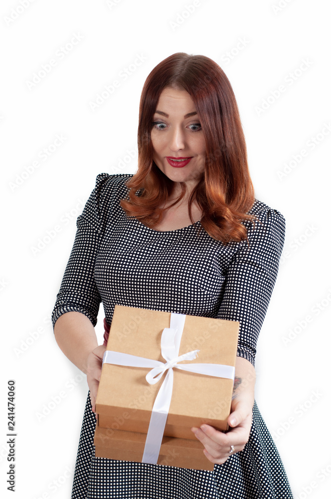 Image of shocked excited teenage girl standing isolated over pink background holding gift surprise box. Looking aside. Image of shocked excited teenage girl standing isolated over pink background holding gift surprise box. Looking aside.