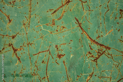 rusty scratches on green painted steel texture