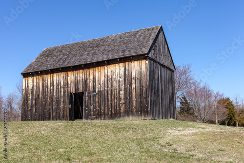 Barn on a hill with door open