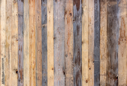 Multicolored wooden surface with old faded paint texture