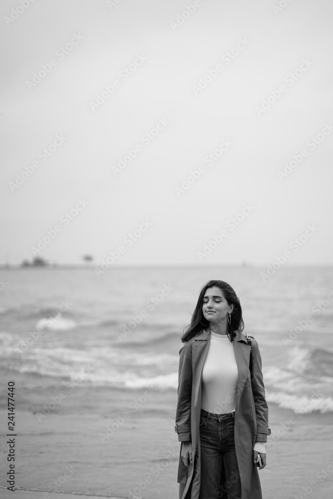 young girl walking on the beach