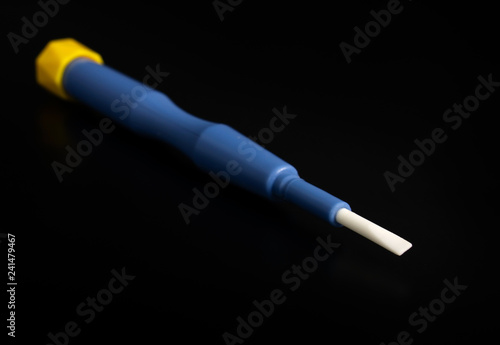 Non-conducting, non-metallic and non-magnetic ceramic screwdriver for trimmers on black background