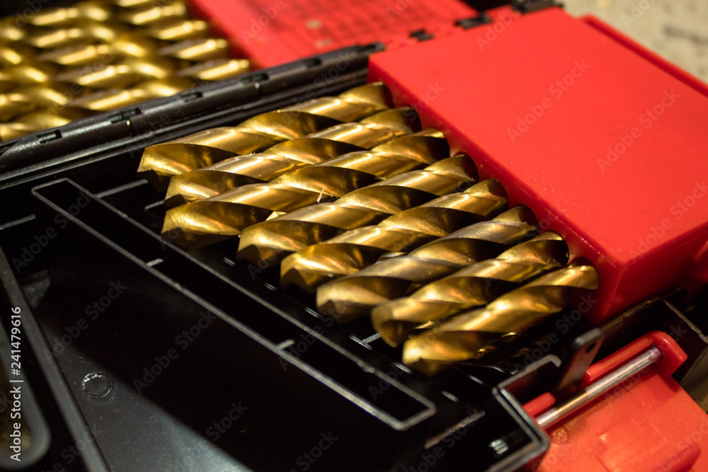 Drills in a black tool box cleaned up and ready for work 