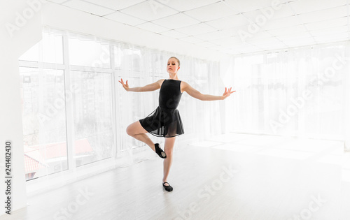 Young ballerina practising ballet moves