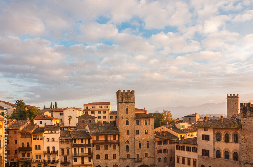 Beautiful clouds over Arezzo medieval historic center with old towers st sunset