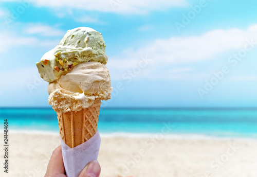 Hand is holding the vanilla ice cream. This is situated in Varadero, Cuba.