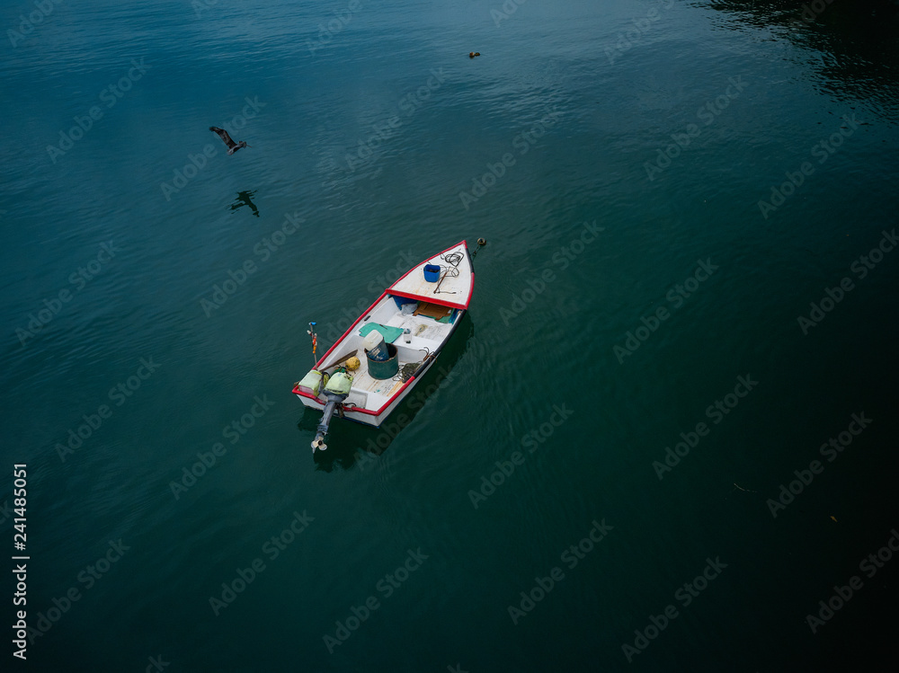 Aerial Drone image of a colorful rowboat just offshore on a Costa Rica Beach Aerial Drone image of a colorful rowboat just offshore on a Costa Rica Beach