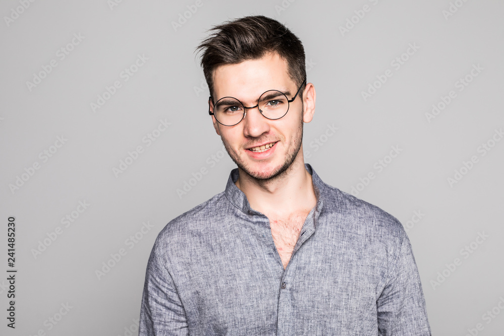 Portrait of a handsome young man isolated on gray background
