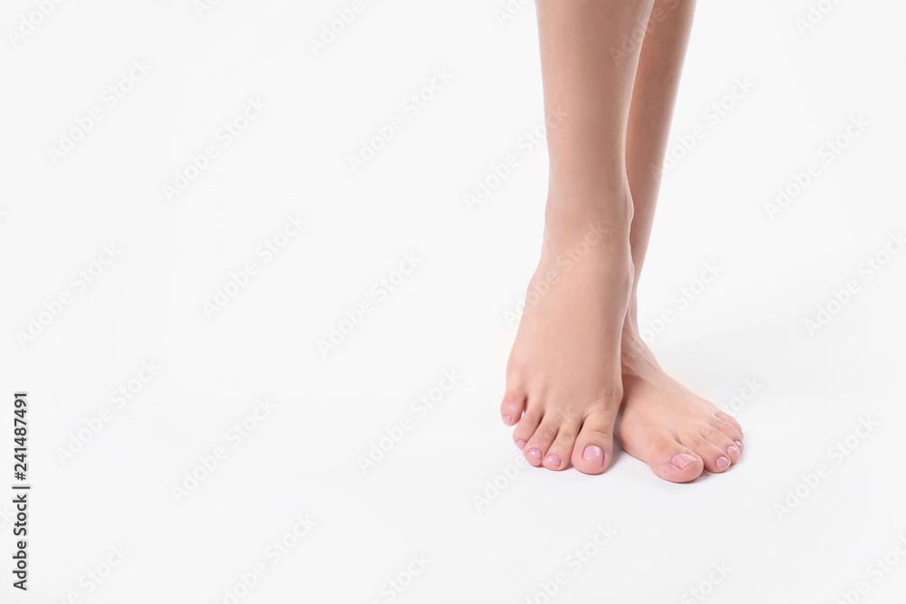 Woman with smooth feet on white background, closeup. Spa treatment Woman with smooth feet on white background, closeup. Spa treatment