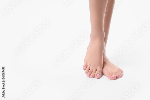 Fototapeta Naklejka Na Ścianę i Meble -  Woman with smooth feet on white background, closeup. Spa treatment