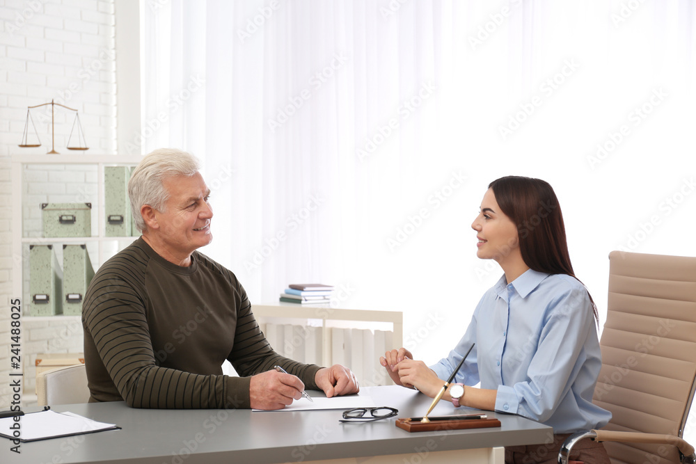 Lawyer having meeting with client in office Lawyer having meeting with client in office