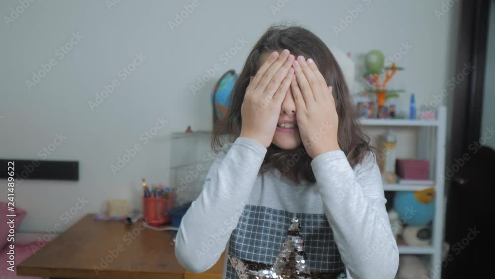 hide and seek. little girl covered her eyes face with her hands peek a boo waiting for a surprise. slow motion video. lifestyle teen girl playing bo-peep. childhood concept game hy - spy hide and seek. little girl covered her eyes face with her hands peek a boo waiting for a surprise. slow motion video. lifestyle teen girl playing bo-peep. childhood concept game hy - spy