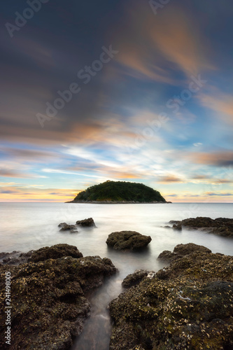 Sea and boulders foreground with long exposure shot when sunset. Shot at Yanui Beach  Phuket  Thailand.