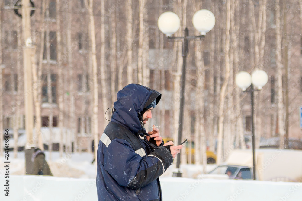 Portrait of a young man in a jacket with a hood Portrait of a young man in a jacket with a hood