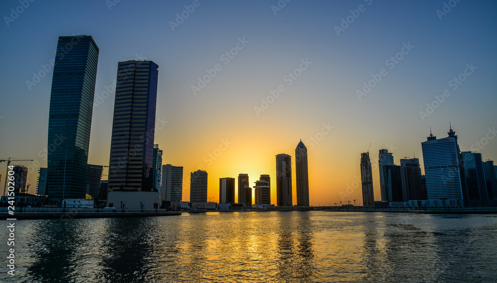Modern buildings at sunset in Dubai, UAE Modern buildings at sunset in Dubai, UAE