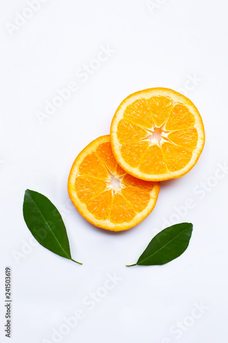 Fresh orange citrus fruits with leaves on white background.