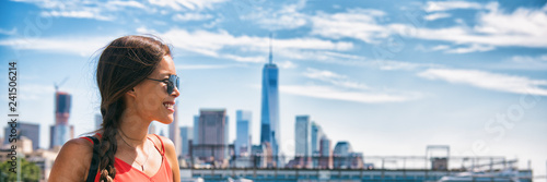 New York city woman tourist at One World Trade center skyline summer vacation USA travel lifestyle. Tourism in the USA. NYC banner panorama background.