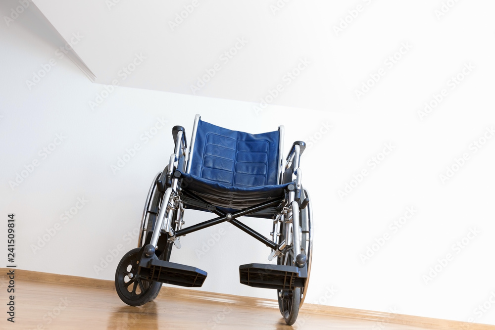 Empty invalid chair at home. Wide angle, collapsed horizon. Empty invalid chair at home. Wide angle, collapsed horizon.