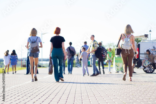 group of people walking on city street