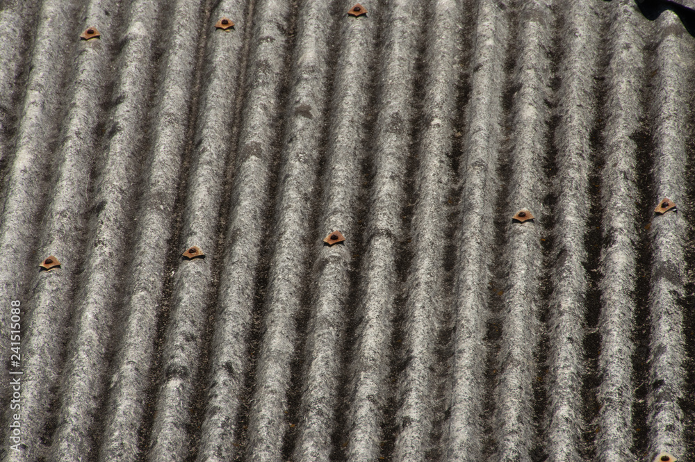 Corrugated roofing, concrete, stressed and weathered Corrugated roofing, concrete, stressed and weathered