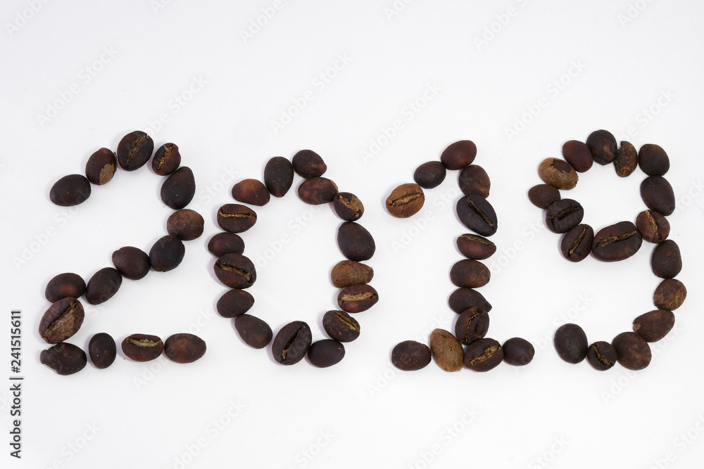 Text 2019 write by coffee beans. Royalty high-quality free stock macro photo image of shape 2019 design text by roasted black coffee beans, coffee beans background. Close-up or macro photo coffee bean Text 2019 write by coffee beans. Royalty high-quality free stock macro photo image of shape 2019 design text by roasted black coffee beans, coffee beans background. Close-up or macro photo coffee bean