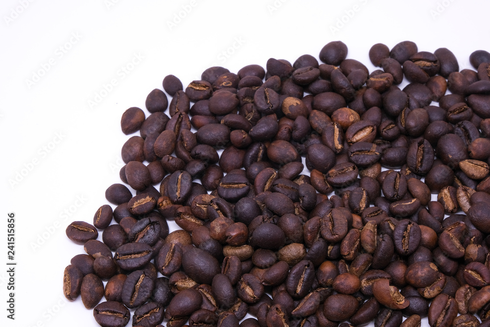 Fototapeta premium Coffee beans background texture with copy space for text. Royalty high-quality free stock macro photo image of roasted black coffee beans, coffee beans background. Close-up or macro photo coffee bean