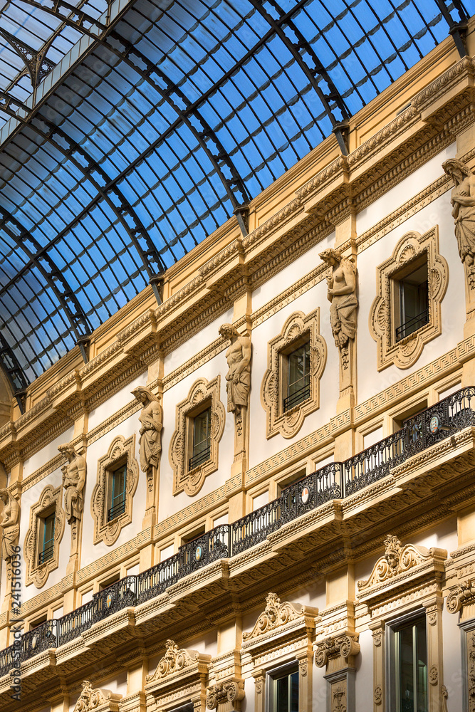 MILAN, ITALY - SEPTEMBER 28, 2018: Gallery Vittorio Emanuele II, luxury shopping mall. It was designed and built by architect Giuseppe Mengoni between 1865 and 1867 MILAN, ITALY - SEPTEMBER 28, 2018: Gallery Vittorio Emanuele II, luxury shopping mall. It was designed and built by architect Giuseppe Mengoni between 1865 and 1867