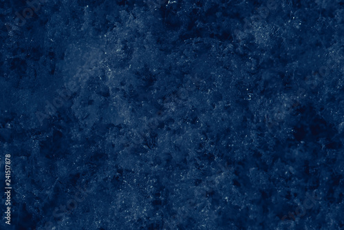 Cold snowy icy blue background. Cold winter weather texture. Snowflakes abstract background