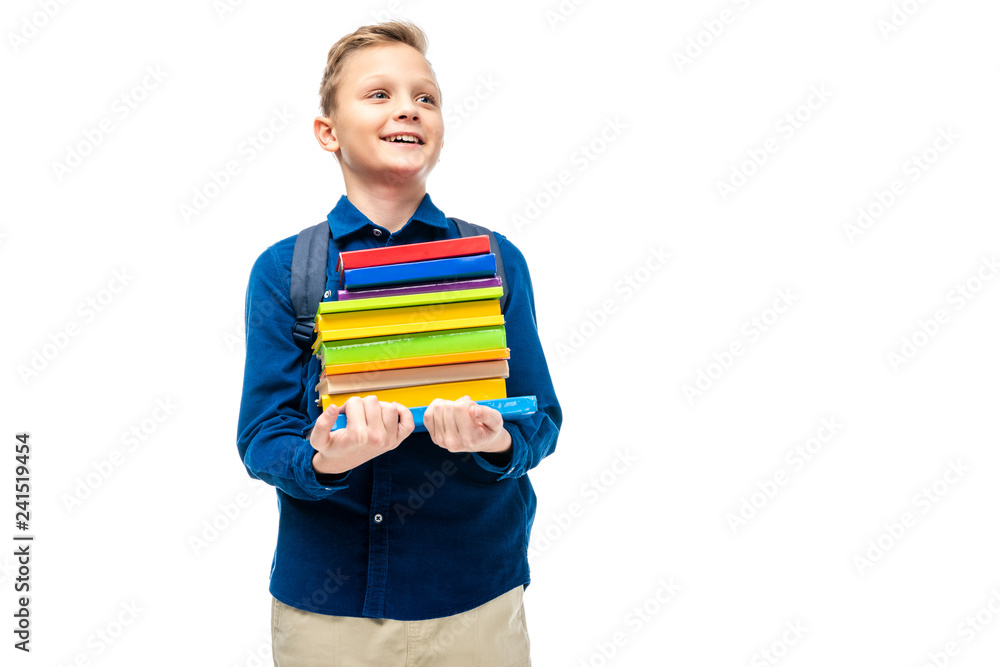 smiling boy holding stack of books isolated on white smiling boy holding stack of books isolated on white
