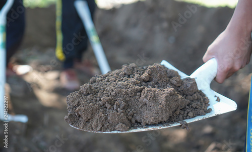man hand digs soil and soil with a shovel. Close-up, Concept of gardening, gardening.