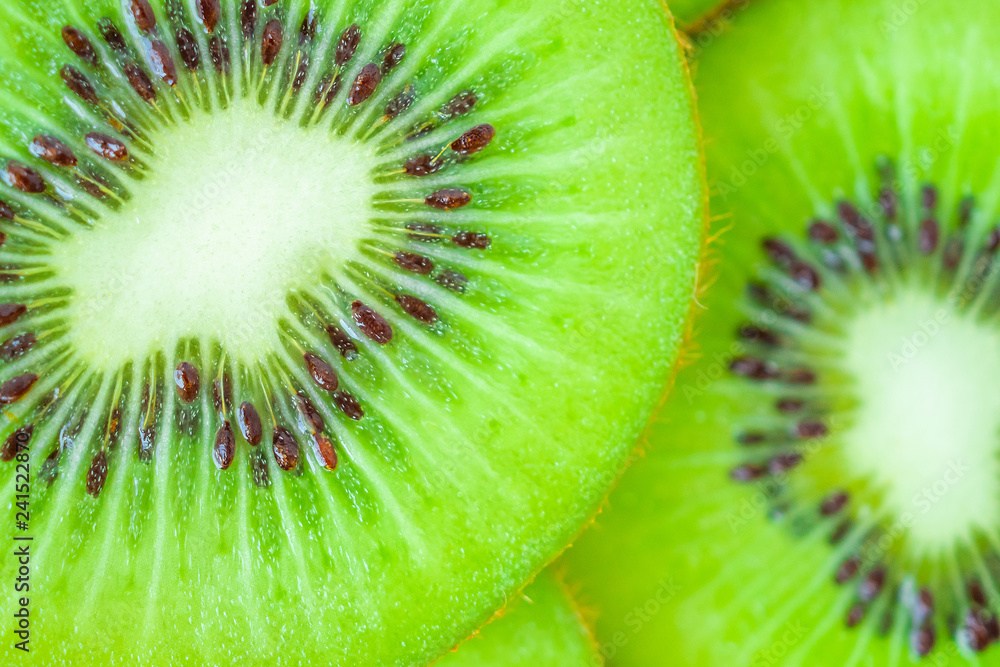 Fresh kiwi fruit slices closeup macro background Fresh kiwi fruit slices closeup macro background