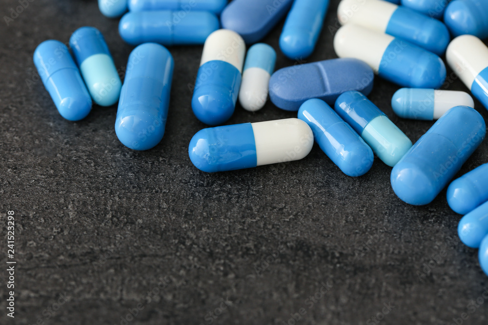 Colorful pills on grey background Colorful pills on grey background