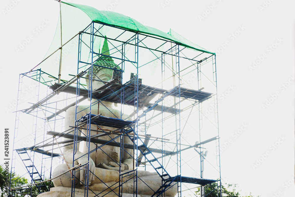 Repair Buddha statue with bright light under construction