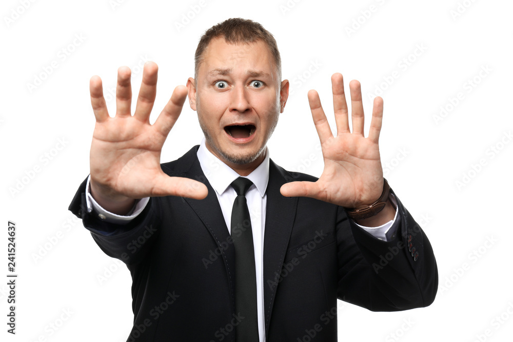 Businessman having panic attack on white background Businessman having panic attack on white background