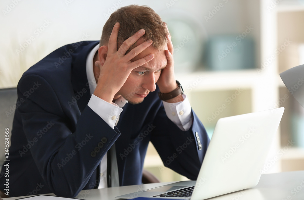 Man having panic attack at workplace in office Man having panic attack at workplace in office