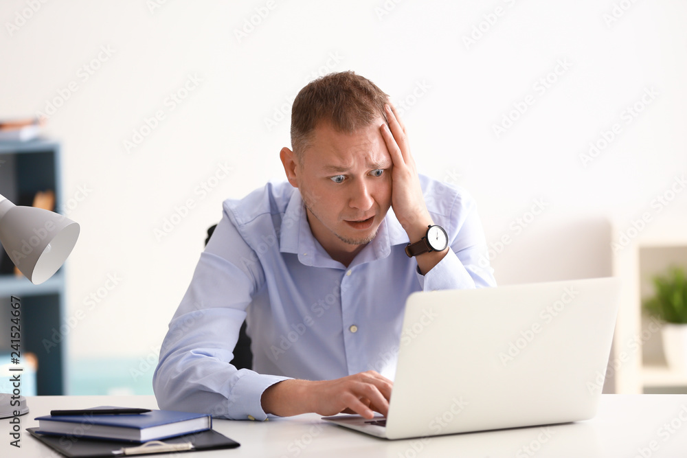 Man having panic attack at workplace in office Man having panic attack at workplace in office