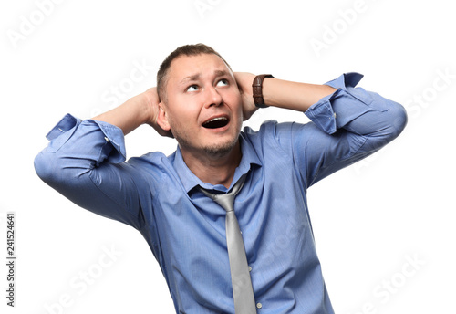 Businessman having panic attack on white background