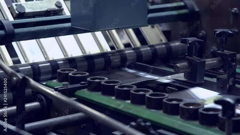 printing machine prints some brochure or newspaper close up details