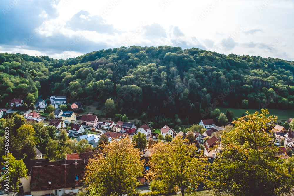 Beautiful view of the town in the mountain area, near the dense wood in Germany. Summertime of year. Beautiful view of the town in the mountain area, near the dense wood in Germany. Summertime of year.