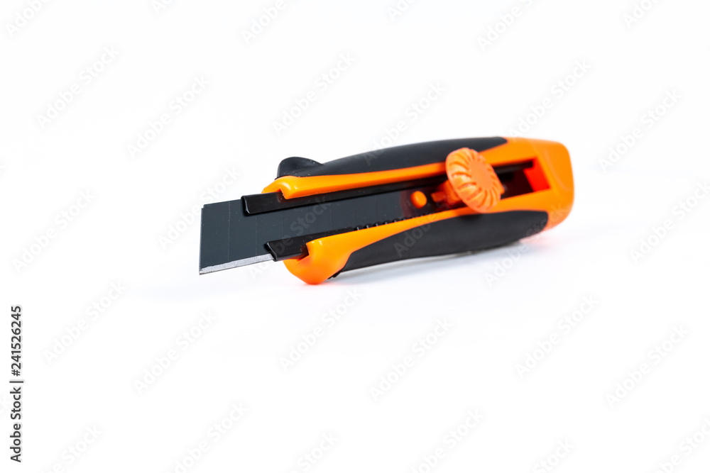 Orange and back paper knife or cutter on white background Orange and back paper knife or cutter on white background