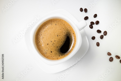 Coffee espresso. Coffee cup and coffee beans on white background closeup. Top view