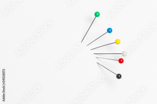 Group of pushpins isolated over white background