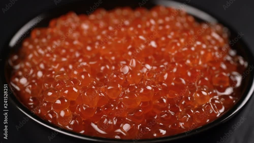 Red Caviar rotated over black background. Red Caviar rotated over black background.