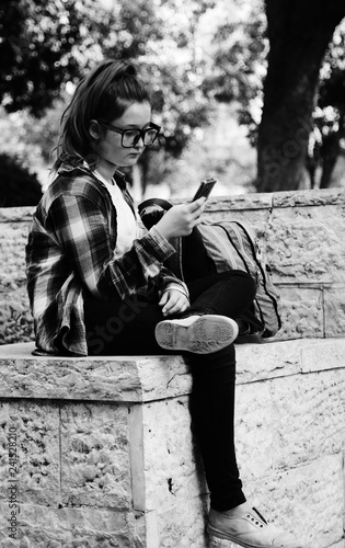 Portrait of tenage girl sitting outdoor photo